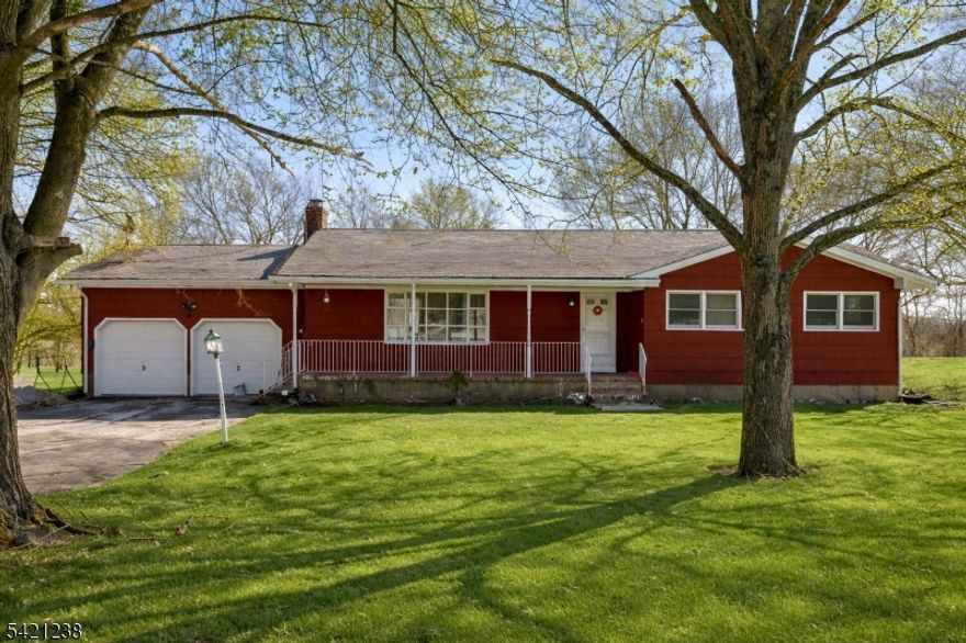 Welcome to this spacious ranch-style home set on 4.96 picturesque acres, offering breathtaking panoramic mountain views and peaceful country living. This home features 4 generously sized bedrooms and 3 full bathrooms with a large basement rec room providing ample space for comfortable living. Step outside to a pond, 2 stall barn with tackroom and  enjoy your private in-ground pool while taking in the stunning natural surroundings. A 2-car garage adds convenience, and the expansive property offers endless possibilities.