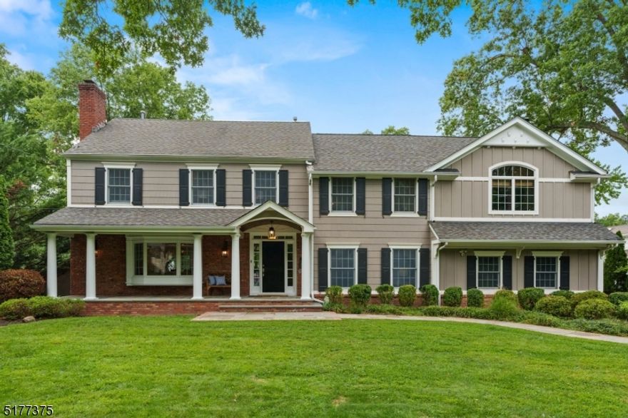 Spectacular colonial home with ideal open floor plan! Custom designed and expanded with attention to detail. This 4-5 bedroom home offers an open floor plan with stunning gourmet kitchen with professional stainless steel appliances, two dishwashers, over sized center island, walk in pantry and sky lights all open to large family room and dining room, architectural windows showered this area with natural light all overlooking the expansive level yard, A large formal living room, mud room accessing 2 car garage, laundry and powder room complete the first level. The enormous two room primary suite will take your breath away, vaulted ceilings, architectural windows, custom built ins, fireplace, spa like bath with soaking tub, radiant heated floors, walk in closet, laundry connection and a sitting balcony looking out over property. Three additional spacious bedrooms and full update bath complete the second level.  The finished lower level features a recreation room, guest area with full bath and cellar. This home is perfectly located on .48 of an acre of beautifully landscaped and fenced in property.  Low taxes! Close to top rated millburn schools, towns and NYC trains.