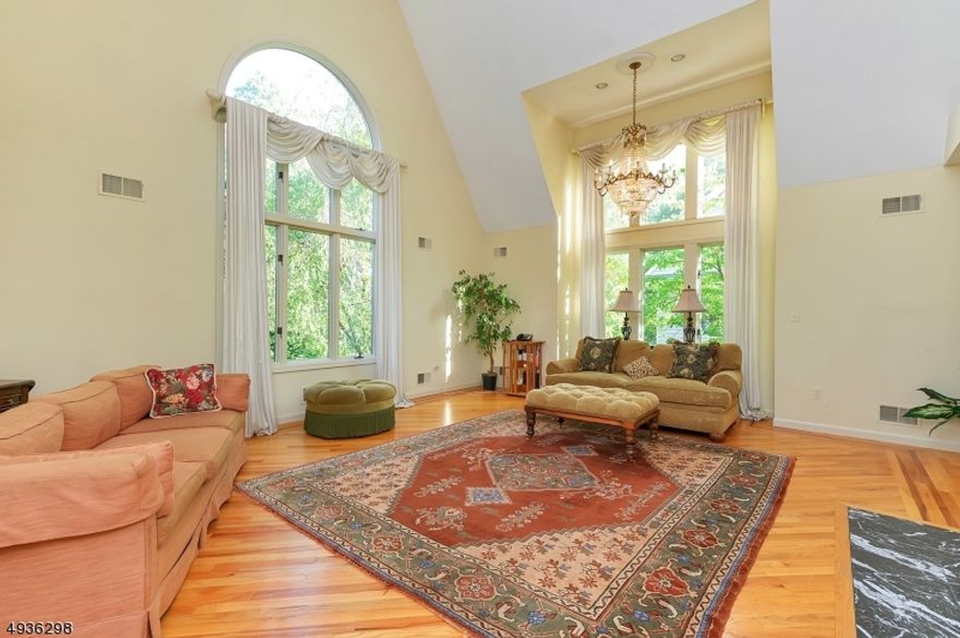 Spacious and custom built in 1990, this 4 bedroom, 3.5 bath colonial is situated on a desirable street within 1 mile to downtown Summit. Appr. 3,550 sq. ft per tax records. Great flow, generously sized rooms and high functionality. First floor features a welcoming entry foyer with powder room, living room with soaring ceiling/windows, large family room with built in cabinets, open kitchen with eat-in area, office space and walk-in pantry, formal dining room and bonus wet-bar area.  The second floor offers 4 bedrooms and three full baths.  Master bedroom has 2 walk in closets and large master bath.  Finished basement.  Recent updates include new roof 2024, newer appliances and new fencing in yard. Added features include hardwood floors throughout, laundry room on the first floor and a three car garage.  Walk or short drive to all schools.   Great opportunity to update and make it your own! Being sold strictly in "as is" condition. Buyer responsible to obtain Certificate of Occupancy.