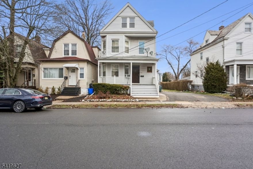 Wonderful 3-family home in a great location, set on a large double lot. This property offers an easy commute into NYC, with a bus route just one block away, and is conveniently located near schools, shopping, and parks. One unit features an updated kitchen and bathroom, while the remaining units offer a great opportunity for customization and value-add improvements. The home includes charming details such as beautiful stained glass, an open front porch, wood floors, and high ceilings throughout. There is also a full basement with potential for future finishing.The oversized lot provides ample parking along with a park-like outdoor space, perfect for summer gatherings and entertaining