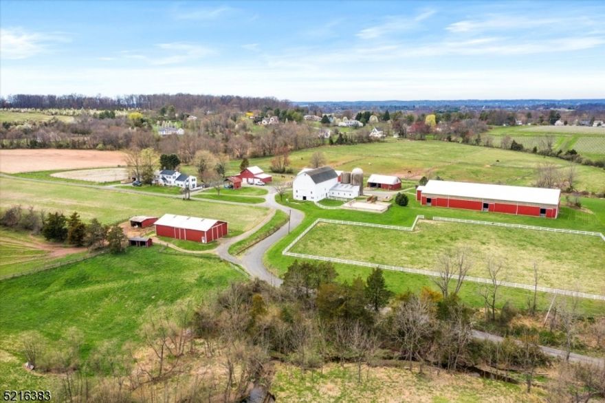 Amwell Ridge Farm is sited on 135 preserved acres in East Amwell Township with gentle rolling hills & sweeping country vistas in every direction. It's most recent use as an equestrian facility, this private oasis offers endless opportunities. Whether you are looking for crop use, animal use, your very own vineyard, or to simply enjoy peaceful country living, you will find it here w/in commuting distance of Philadelphia and NY. The grounds include framed carriage house w/4 bays, cinderblock barn, 2 Morton buildings, indoor & outdoor riding arena, frame bank barn, and circa 1800 Colonial farmhouse w/attached cottage.   The 3 bdrm, 2   bath farmhouse has charming details intact including Dutch door entrance, exposed beams, wide pumpkin pine floors, family rm walk-in fireplace &  built-in cupboards.   The 2 story adjoining 1bed/1 bath cottage w/living rm, dining area & updated kitchen is well suited for farm laborers/guests.   The riding facilities encompass a frame bank barn with 14 box stalls, tack room, heated wash stall,& storage in the loft.  An indoor riding arena and heated viewing room is used year round. There is also an outdoor arena, 2 run in sheds, fenced exercise paddocks & meadows.  Apart from the riding facilities, there are acres of tillable land, a pond,  5+acre building lot (with conservation easement) , access to the Amwell Valley Trail System & vineyard that produces award winning single vineyard wines processed at the neighboring Unionville Vineyards.