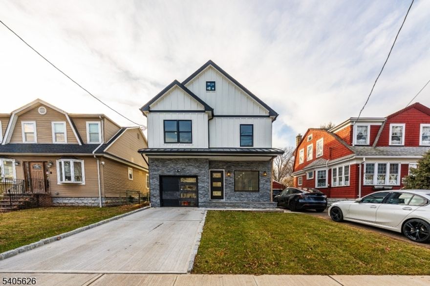 Discover this brand-new construction home offering luxury finishes,elegant design, and move-in ready living. Built with premium materials, this residence offers an exceptional curb appeal with a stone front facade and elegant detailing and a  bright open-concept first floor with hardwood floors throughout, recessed lighting, and 9-foot ceilings.The main level is filled with natural light from an extra-large front window and features double French doors that open directly to the backyard perfect for entertaining and indoor-outdoor living. The fully equipped chef's kitchen showcases gray shaker cabinetry, quartz countertops, and a large center island. This 4-bedroom, 3-full-bath home includes a spacious primary suite with a private en-suite bath, double sinks, and a walk-in closet. Additional bathroom also feature double vanities for added comfort and functionality. Some highlights include Andersen windows, two units central A/C,  and two forced-air heating system, a tankless water heater, 200-amp electrical service, and a fully finished basement ideal for a family room, home office, or guest space. The laundry room is equipped with a brand-new washer and dryer. A built-in garage and oversized attic provide ample storage.  A true Commuter's Delight, with a bus to NYC around the corner and the train station just few blocks away, plus close proximity to supermarkets, pharmacies, shopping, and houses of worship a perfect blend of style, comfort, and convenience.