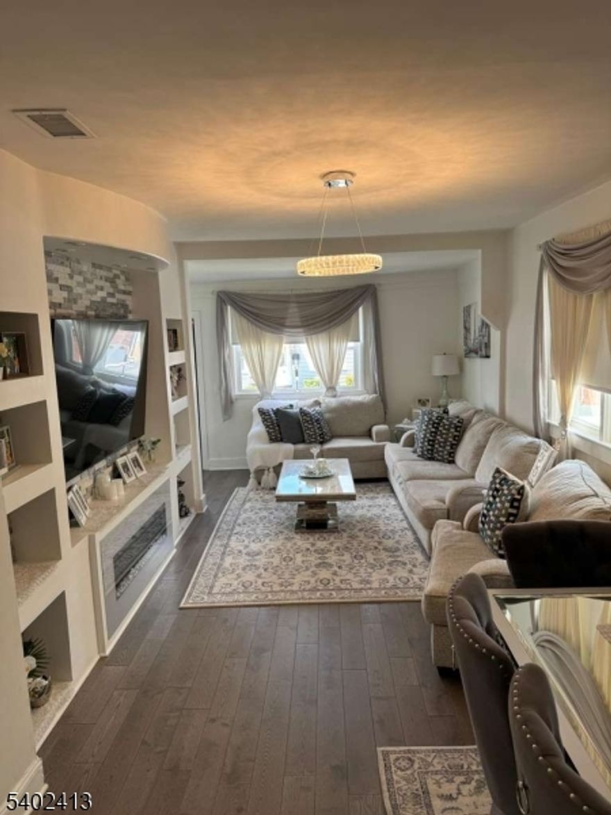 Very nicely updated. 1st floor has 2 bedrooms, kitchen, living room/ dinning room , full bath. 2nd floor 1 bedroom, full bath. fully finished Basement 2 rooms, family room, laundry room. Driveway & backyard. Priced for quick sale.