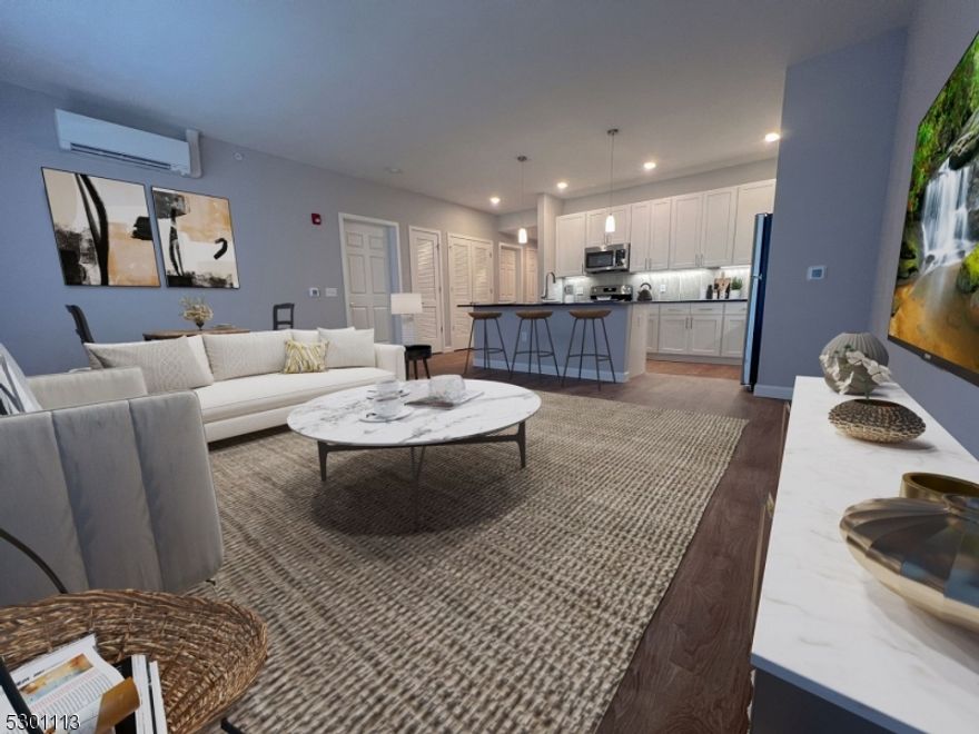 Beautiful well appointed 1 Bedroom corner unit apartment w 1 Bath features ample space with great naturallight and luxury finishes - quartz countertops, stainless steel appliances, washer and dryerin unit, + more! Soaring ceilings, beautiful views of the town, and the downtownconveniences you can't live without - that's what you'll find at Titan Union.Fitness Center, Media Screening Room, Rec Room and Rooftop Terrace and Lounge.  Adjacent to coworking space and Event Center. Easy acccess to NYC by bus or train. Trash, recylicing included. 3 month promotional internet and small storage. $300 Annual Amenity Fee. Covered Parking $85/month or $21/month open lot parking. Storage $35-$80/month. Pets: $500 dep+$50/month each.