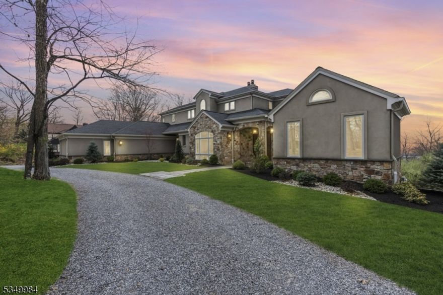 This custom-built estate is a true work of art designed to capture light, luxury, and sweeping views at every turn. Thoughtfully crafted with large, custom windows and doors, the home seamlessly blends sophisticated design with comfort, offering panoramic vistas from nearly every room. Step inside the main level, where the heart of the home features a unique, chef-inspired kitchen with ample cabinetry and an open flow perfect for entertaining. The family room is anchored by a cozy fireplace, and the spacious living and dining rooms provide elegance and ease for gatherings. A private office, guest bedroom, and 1.1 baths complete this floor, along with direct access to a stunning deck overlooking breathtaking scenery. The second floor is home to a luxurious primary suite with its own private balcony showcasing jaw-dropping views, along with two additional bedrooms and a full bath. Cedar closets add a refined touch, blending practicality with timeless craftsmanship. The walk-out lower level is a world of its own featuring a one-of-a-kind wine cellar, home gym and sauna, multiple game and recreation rooms, an additional office or guest suite, a full bath, and a spacious lounge area that opens directly to the beautiful backyard and its views. With 5 bedrooms, 4.1 bathrooms, multiple walkouts, and unmatched architectural detail throughout, this residence offers a rare opportunity to own a truly extraordinary home where every window frames a picture-perfect view.