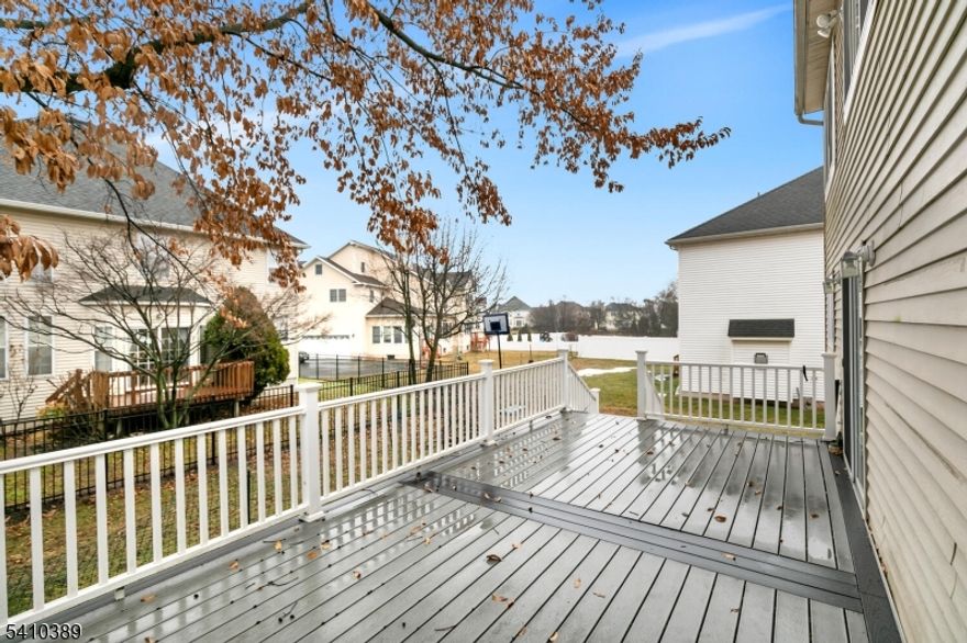 Tucked within a desirable Bridgewater neighborhood, this beautifully updated Colonial showcases modern hardwood flooring throughout, new(2024) energy-efficient windows, solar panels, and a designer kitchen blending timeless architecture with modern comfort and sustainable efficiency. Sun-filled interiors feature spacious living and dining rooms, a warm family room with a cozy gas fireplace, and a bright breakfast area that flows into the designer kitchen with dramatic black Silestone quartz countertops, GoldenHome luxury-line cabinetry, stainless steel appliances, and generous prep space.Upstairs, four spacious bedrooms include a primary suite with two walk-in closets and a private modern bath. A finished recreation room in the basement, offers flexible space for a media room, home office, gym, or playroom.Enjoy outdoor living on the large maintenance-free deck(2021) overlooking the easy-care backyard. Solar panels help offset utility costs, and a dedicated EV charging outlet is located in the garage.Conveniently located near Routes 202/206, 22, and Interstate 287, with easy access to shopping, parks, and the vibrant dining scene of Bridgewater and nearby downtown Somerville. Located in the highly rated Bridgewater-Raritan School District, with students attending Milltown Primary School.