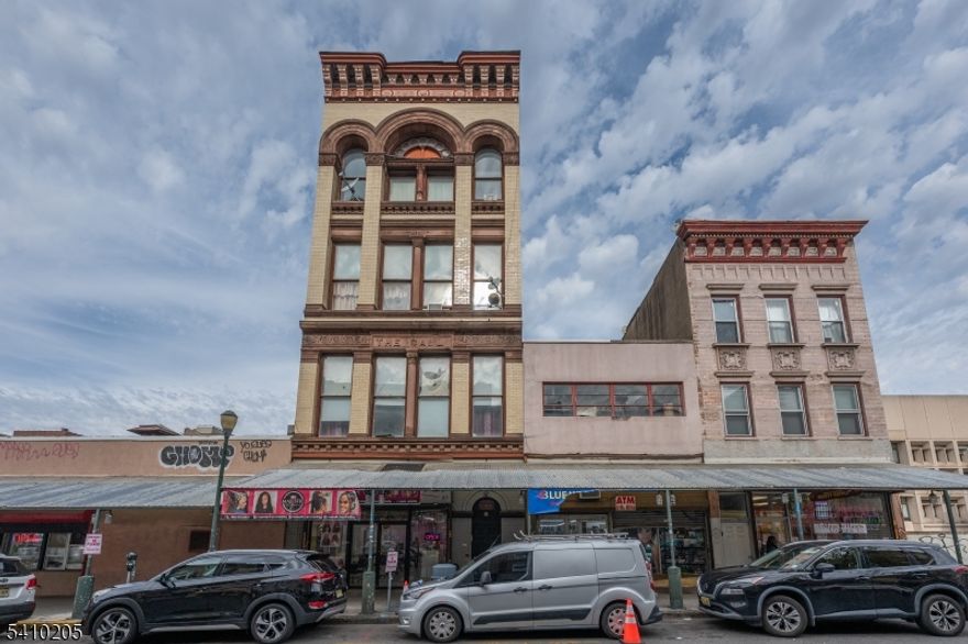 Spacious mixed-use investment opportunity located in the heart of vibrant downtown Paterson. This over 9,000 sq ft building features seven total units, including three 3-bedroom apartments, three 2-bedroom apartments, and a large street level storefront with excellent visibility and foot traffic.The property offers strong income potential, with projected rents of up to $20,000 per month. Ideal for investors seeking a high-yield asset in a growing commercial corridor, close to public transportation, shops, restaurants, and major highways.The storefront is currently vacant, presenting a prime opportunity for an owner-user to operate their own business while collecting rental income from the residential units, or for an investor to secure a substantial income producing property in a prime location.