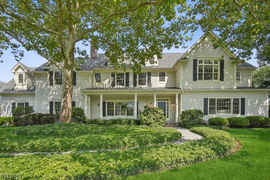 An impressive home by any measure, this exceptional center-hall CUSTOM built home is certain to turn heads. Built in 2011 on the existing foundation, this residence is a testament to refined elegance and exceptional craftsmanship boasting beautiful hardwood floors, two fireplaces, quality built-ins and gorgeous millwork throughout. As you step inside, you are greeted by the foyer, flanked on either side by the stunning formal living room and elegant dining room. Featuring a Chef's eat-in kitchen with high-end Wolf/SubZero/KitchenAid stainless steel appliances, center island with seating, soft-close wood cabinetry, granite counters, breakfast area and a large walk-in pantry. The EIK flows into the family room and provides easy access to the rear patio that overlooks the heated pool and tranquil backyard oasis. Truly a wonderful home to entertain loved ones inside and out. This level also includes a convenient first floor bedroom/office, a powder room and a full bath. The luxurious primary suite features a vaulted ceiling, cozy fireplace, two massive WIC's and a spa-like bath offering heated floors & dual vanities.  The guest bedrooms are extremely spacious and feature WIC's w/organizers. The finished lower level offers a rec. room, wet bar and plenty of storage. This home also includes multi-zone HVAC, 3-car garage, Kohler whole house generator, mature and private landscaping, sprinklers and much more! Close to top-rated schools, parks, downtown Westfield, and NYC train & bus.