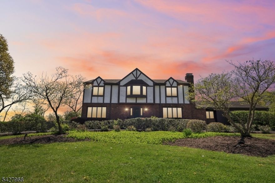 Set on a gorgeous corner lot in a serene and desirable cul-de-sac, this stately Colonial offers space, location, and incredible potential. The home features five bedrooms and three full bathrooms, with generously sized rooms throughout.  A circular driveway and two-car garage provide a welcoming first impression, while classic elements like hardwood floors, a formal  dining room and a large living room add to the home's timeless layout. The main level also offers a versatile office or guest room, along with a nicely sized family room perfect for everyday living and gathering. The fully finished basement expands the living space even further, offering endless possibilities for recreation, work, or entertaining. The fenced-in backyard is ideal for outdoor living, complete with a large deck, plenty of room to gather and play, and a separate dog run area or garden.Conveniently located within walking distance to the community pool, gazebo, Elm Street Park, a walking path and athletic fields, this home combines everyday convenience with neighborhood charm. Offering flexibility and room to personalize, this home can easily be tailored to suit today's lifestyle. With its impressive size, layout, and prime location, the possibilities here are truly exceptional.