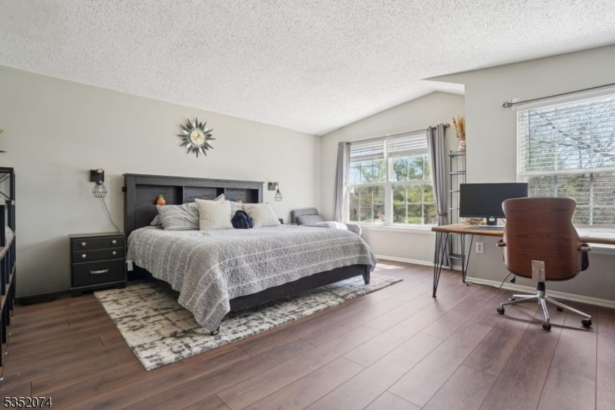 Welcome to this highly sought-after, 3 bedroom, 2.5 bath townhome in the desirable Rose Arbor community. As one of the complex's largest units with over 1,700 sq ft of living space, a 1-car garage, and abundant additional parking, this home offers both space and practicality. A covered entryway leads you up a set of stairs to the inviting main level, featuring a spacious living area with impressive 9-foot ceilings, a dedicated dining space, well-equipped kitchen, and powder room. On the top floor, you'll find three generously sized bedrooms plus a versatile bonus room - perfect for a home office, gym, playroom, or extra storage. The oversized primary suite impresses with vaulted ceilings, two expansive walk-in closets, and a luxurious ensuite bathroom complete with a shower and soaking tub. Laundry is conveniently located on the upper level for ease of use. All public utilities are in place, ready for you to move in and make it your own! Ideally located just minutes from Morristown Green, NJ Transit, and major highways, convenience is at your doorstep.