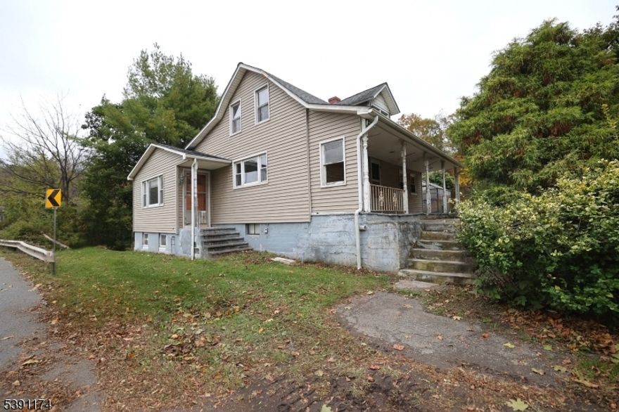 Welcome to this inviting 3-bedroom, 2-bath single-family home situated on a 1.55-acre lot in beautiful Andover Twp. This home offers comfort and versatility, featuring a large living room and an open kitchen. Outside, you'll find a spacious detached workshop equipped with 12-foot garage doors, its own separate power service, and a full-length loft area, offering endless possibilities for projects or storage. An additional single-car garage adds convenience and function. Enjoy the expansive outdoor space with plenty of yard for recreation or relaxation. The pool is in need of repair but ready for your personal touch. With its generous space, flexible layout, easy access to Route 15 and 80 this property is being sold as-is and is ready to welcome its next owners home.