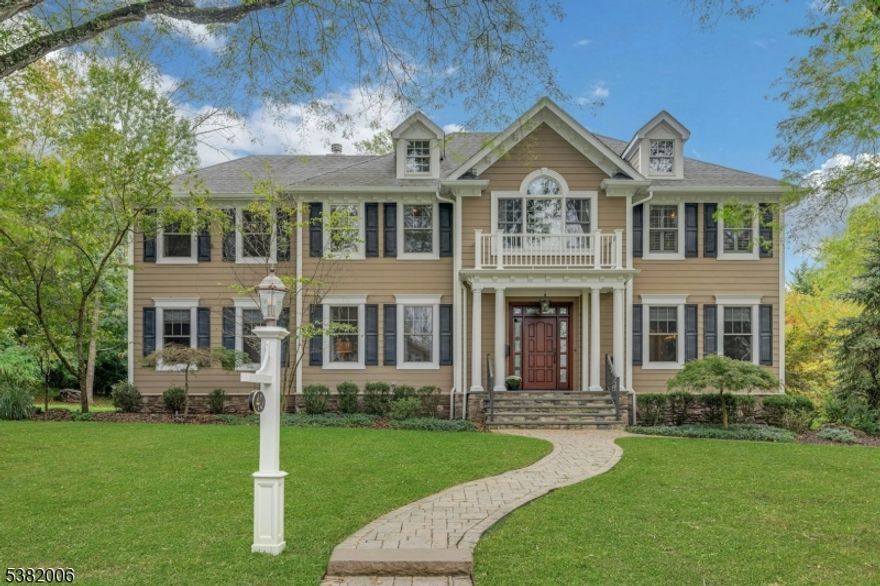 Welcome to this stunning custom Colonial, perfectly situated in one of Short Hills' most sought-after neighborhoods just moments from everything Millburn has to offer. From its thoughtfully designed floor plan to its high-end finishes, this home delivers the space, style, & convenience you have been searching for. The main level is designed for both everyday living & elegant entertaining. Formal living & dining rooms set the stage for gatherings, while the expansive family room anchored by natural light streaming through oversized sliding doors flows seamlessly into the chef's kitchen. A butler's pantry connects the dining room & kitchen for effortless hosting. A first-floor bedroom with full bath offers ideal flexibility for guests or an office.Upstairs, the impressive primary suite feels like a private retreat, complete with a sitting room, spa-like bath, & huge walk-in closet. Three additional bedrooms each with their own en-suite bath provide comfort & privacy for everyone.The beautifully finished lower level expands the living space with a large recreation room, gym, home office, & a convenient mudroom with direct garage access.Outdoors, a generous corner lot invites play & relaxation with a flat side yard, expansive patio, & a built-in outdoor kitchen perfect for entertaining.This home truly combines the best of timeless Colonial style with modern luxuries in an unbeatable Short Hills location. Don't miss the opportunity to make it yours.