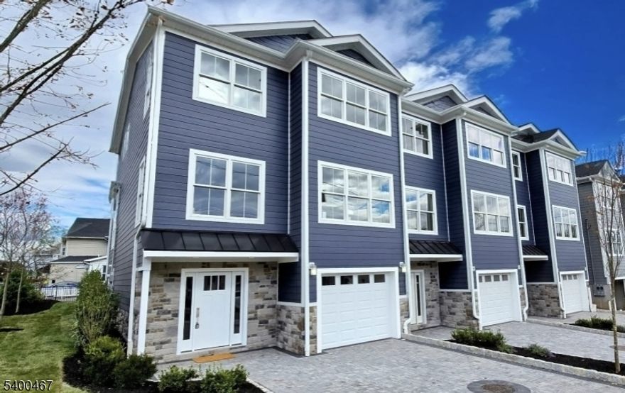 Brand New Modern Luxury " Single Family Home " No HOA! This new 3-level, 2,627 sq. ft. home combines modern design with everyday comfort. Andersen High Performance windows, 9' ceilings, and hardwood floors enhance the open main level, featuring a designer kitchen with quartz countertops and full quartz backsplash, 2-tone cabinetry w/ center island, and all GE stainless steel appliances. The kitchen flows into the dining and living areas, creating a great space for both entertaining and daily living. The primary suite offers a spacious bathroom with double sinks, a glass-enclosed walk-in shower, and a generous closets. You will also find a 2nd bedroom, full guest bath, washer/dryer and flexible office or den. The 1st level includes a recreation/media room, powder room, and full laundry room equipped with full size GE Washer/Dryer & sink. A private 14' x 12' deck, extensive professional landscaping with sod and shade trees creates a beautiful setting. Exterior includes Stone, Hardie Plank siding, paver driveway, and insulated garage with opener. Parking accommodates 3 vehicles. Additional highlights include designer Kohler fixtures and lighting, 2-zone central A/C, natural gas heat, and fire sprinkler on all floors. With no HOA fees, a 10-year homeowner warranty, and a location minutes from NYC transit, dining, shops, and top-rated schools, this home delivers style, function, and long-term value.