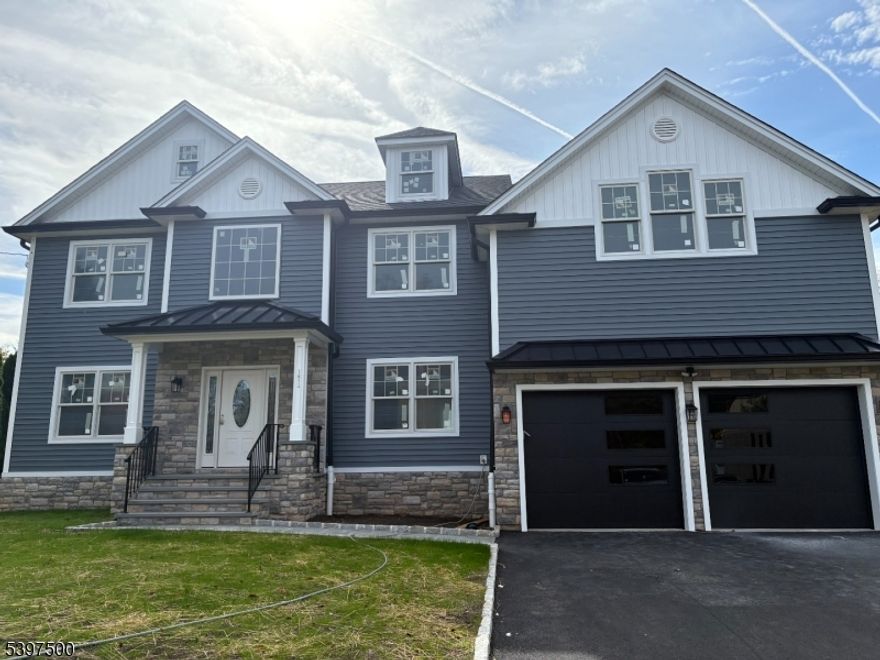 Brand new construction with many upgrades quartz countertops, custom cabinets, moldings, extra high hats, gas fireplace, large center island, hardwood floors throughout, walk up attic stairs, composite deck and generous size rooms with 8FT ceilings.  Master has two large walk-in closets and sitting area with a freestanding tub and large shower in bath. Quality workmanship throughout with partially finished basement with high ceiling and half bath with a storage area.