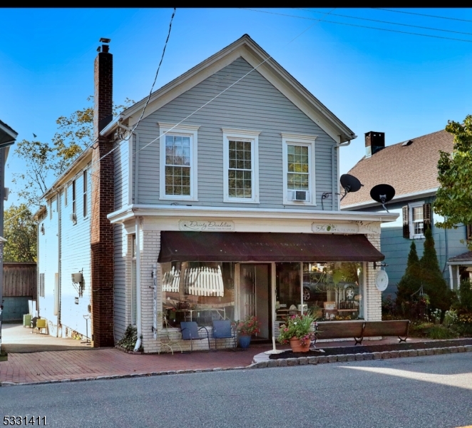 Welcome to 58-60 Main Street in Chester. This mixed-use property presents an extraordinary opportunity to invest in the heart of historic Chester Borough. #58 Main street offers a commercial unit with potential to be divided into 2 more retail spaces. #60 Main street offers 2 side by side storefronts and 2 apartments on the 2nd floor. There is a parking lot and oversized barn with loft and 3 garage bays that could be used in so many different ways. It offers a variety of income streams and potential uses. Embrace the allure of the past while reaping the rewards of modern real estate possibilities in this captivating property. Owner has long term tenants who are willing to stay. This is a rare chance to own in charming downtown Chester with turn key cash flow immediately.