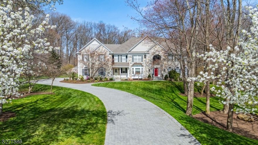 This fabulous, custom-built colonial has a prime location on 3 private acres.  With an open, bright, and airy floor plan, the first level features a 2 story foyer and family room and remaining rooms with 9' ceilings.  A spacious center island tile-floored kitchen with custom Rutt cabinetry opens through French doors to both a formal dining room and a sunroom offering an expansive area that runs from the front to back of the home, and also opens to family room with a gorgeous stone floor to ceiling fireplace. First floor living room, bedroom or office with direct vent fireplace, both a full bath and powder room, and a back stairs to second floor. Second floor features an expansive 51 foot long entertaining/recreation area, almost 1000 sf with custom cabinetry, wet bar and mini-fridge with 10 foot ceiling, abundant closet space, and bathroom access. Also on 2nd fl are 4 bedrooms, primary suite with 2 walk-in closets, bath with private toilet room, jetted tub and shower, and 2 separate vanities. Additional 2 full baths and laundry room on 2nd floor.  Foundation constructed with "I  beans allowing for large unobstructed basement and garage space, both with high ceilings.  4 zone heat and air conditioning. 4 car garage.  All views from this home are a beautiful mature canopy forest. Custom molding, whole house generator, hardwood floors throughout.