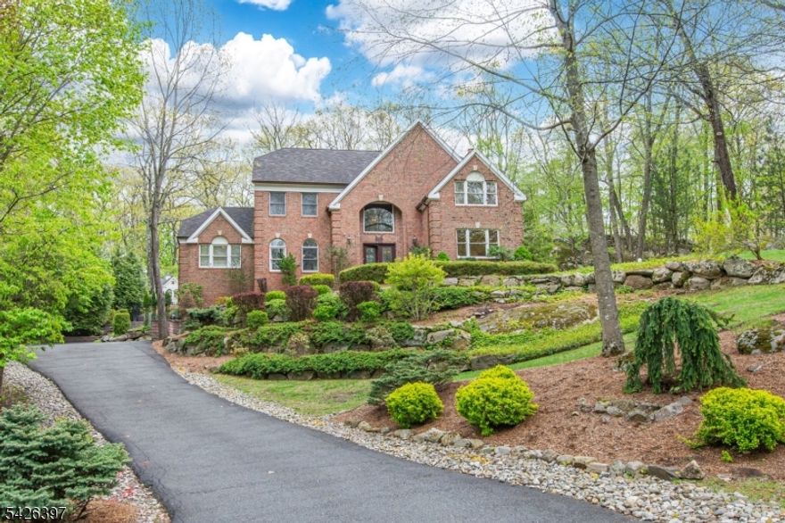 Immaculate and exceptional home in the middle of town...close to shopping and commuter routes. For the buyer who truly wants to just move in and enjoy, this meticulously maintained home delivers at every turn. Custom moldings, tile work and stunning hardwood floors throughout, complemented by a natural gas fireplace. Designer chef's kitchen featuring granite countertops, a Wolf range, Sub-Zero refrigerator, beverage fridge, wine cooler, double ovens, and an impressive 12-foot island. Kitchen opens to a composite deck overlooking a beautifully terraced yard with gazebo, heated gunite pool with waterfall, and an outdoor theater perfect for entertaining. The main level offers a private office, formal dining room, and a first floor bedroom option (or family room) plus a fully accessible roll-in shower. Additional highlights include a brand new boiler, whole house generator, home theater, and a lower-level gym or den. With 4/5 bedrooms, this home offers exceptional flexibility, including a luxurious second floor primary suite with dual walk-in closets and a spa like updated bath plus two more bedrooms and an updated full bath. Walk up third floor with another large bedroom, full bath, and bonus living space ideal sitting room or potential bedroom. Recessed lighting throughout, brick front exterior, and tiled garage complete this truly spectacular offering. Fully automated smart home. *4-bedroom septic.
