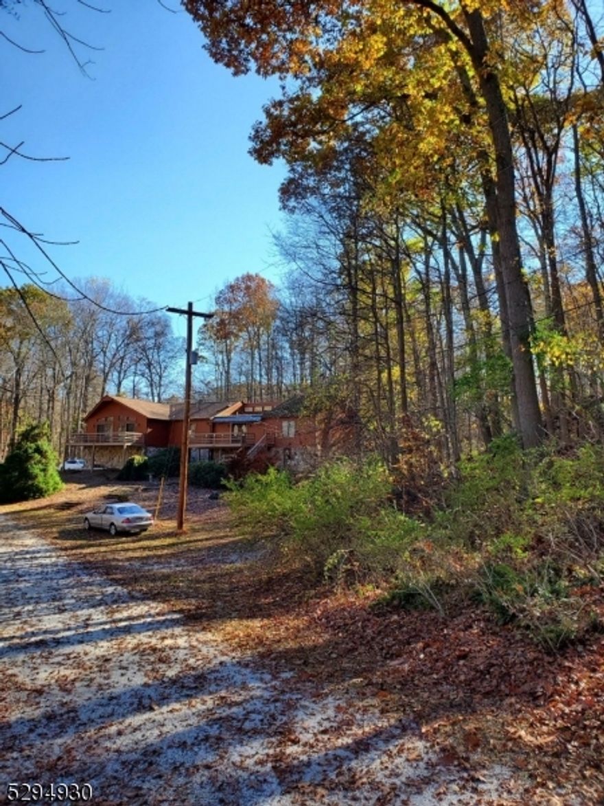 Ideal prepper property or retreat! Unique one of a kind wooded property with field and pond. Borders 5656 acre  Kitatinny  Valley State Park. Utlity Bldng with sliding doors to deck overlooks Twin Lake with boat access to lake.8 stall barn with access to miles of riding trails. Homes lower level with entrance from garage can be used as separate mother daughter apartment or as entertainment area with bar, pool table. Huge marble center island plus family room with fireplace.