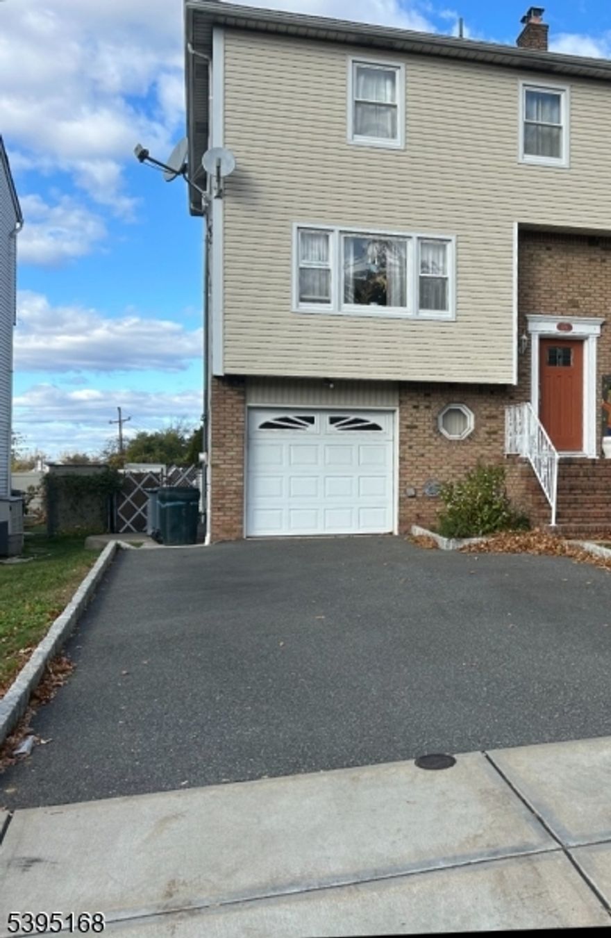 Charming, move-in ready half duplex. Home is in great condition, well loved and taken care of by the owners. Located in desirable Elmwood Park, in walking distance to schools, parks, shops, and bus stops to NYC. The home boasts 4 bedrooms and 3.5 bathrooms. First floor has a large living room with an open floor plan to the formal dining room, directly off of the well sized, eat-in-kitchen. A half bathroom on the first floor saves a trip to your private second floor bathrooms and bedrooms. Second floor boasts a large primary bedroom with primary bathroom, as well as 2 nice sized bedrooms and another full bathroom. The pull down attic access on the second floor is great for extra storage! A full finished ground floor has the final bedroom, full bathroom, along with a "summer kitchen" and glass sliding door access to the custom built oversized rear patio. The one car attached garage has the washer and dryer hook up with access to the ground level. With a four car driveway, parking is a breeze! The large backyard is great for entertaining or quiet relaxation. The rear yard also has a large shed, great for extra storage. Don't miss out on this opportunity!