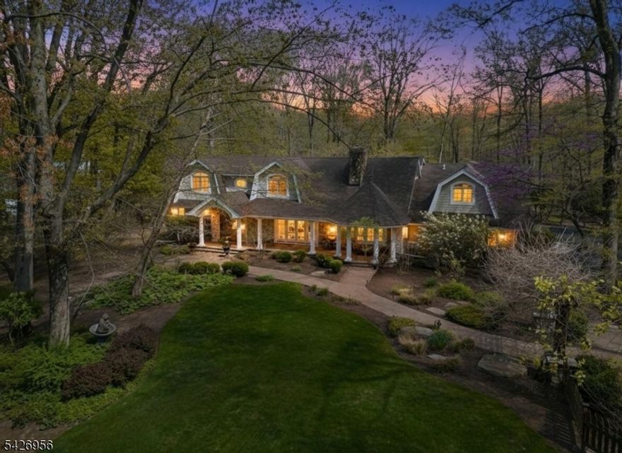 LOCATION, LOCATION, LOCATION!!! Unparalleled serenity awaits at this sprawling 1-acre lot in the coveted East Hill, abutting roughly 25 acres of protected lush nature preserve. Spanning nearly 8,000 SF across 3 expansive levels, this residence features a versatile floor plan that's perfect for grand-scale entertaining while maintaining a warm ambiance.Enter the double-height foyer into a cozy formal living room with wood-burning fireplace. The thoughtfully designed floor plan joins each wing of the home to the expansive family room, adorned with vaulted ceilings and skylights, radiant bluestone floors, and walls of oversized windows and French doors. This space serves as the heart of the home, with a seamless flow into the formal dining room and a large eat-in kitchen with high-end appliances, ample counter space, and a walk-in pantry. This floor also offers 2 bedrooms, a full bath and access to the 4-car garage.Upstairs, a palatial primary suite spans 50 feet and is complete with 2 walk-in closets, spa-like bathroom with deep soaking tub, stall shower and dual vanities, and a private balcony. 2 additional oversized bedrooms, a marble bathroom with double vanity, and a laundry room complete this level.The basement comes equipped with a wet bar and bonus office/guest room.Set on a premier lot with protected views and privacy, the backyard features a large patio completed with outdoor kitchen and water feature. Don't miss your chance to own this one-of-a-kind property.