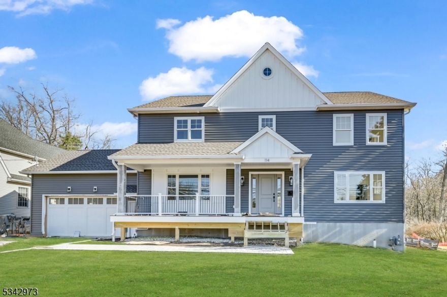 Welcome to this  5-bedroom, 4.5-bathroom NEW CONSTRUCTION custom colonial home, boasting approx 3,400 square feet of living space on a generous nearly half acres. Upon entering through the covered entry porch, you are greeted by a grand 2-story foyer featuring wide-plank hardwood flooring that flows gracefully throughout the home. Elegant trim work and custom millwork add timeless sophistication. The DOUBLE HEIGHT foyer leads to the formal dining room, which seamlessly transitions to butlers pantry/bar area and the open-concept eat-in chef's kitchen. Here, you'll find all stainless steel appliances, quartz countertops, ceiling-height cabinetry, and a well-appointed walk-in pantry. The inviting family room features a fireplace, perfect for cozy evenings and double doors leading to the deck and a flat backyard. The first floor is complete with a guest ensuite, a functional mudroom, and a powder room. On the second floor, you'll discover four spacious bedrooms, including a lavish Primary Suite with two custom walk-in closets and a spa-like ensuite bath featuring a soaking tub and dual sinks. A convenient full laundry room adds ease and practicality. Two additional bedrooms share a full bath with dual sinks, while one bedroom is ensuite.Conveniently located within walking distance to the NY direct bus stop, restaurants, and shops, this home also comes with a 10-YEAR warranty.