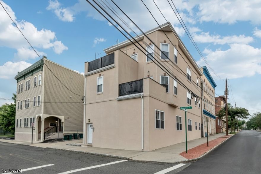 Hard-to-find 3BR/2BA condo in a prime commuter location! Don't miss out on this beautifully updated, move-in ready 3BR/2BA condo with private entrance and soaring ceilings. Sun-filled interior showcases gleaming hardwood floors, central A/C, and an updated eat-in kitchen with granite countertops and stainless steel appliances. Open-concept living/dining area is perfect for relaxing or entertaining. All 3 sun-filled bedrooms boast high ceilings. Versatile finished basement with washer/dryer adds even more storage potential and flexible space ideal for a home office, gym, or playroom. Deeded parking conveniently located next to building. Unbeatable location just 1 block to NYC direct train! Moments to Montclair's vibrant downtown filled with top-rated dining, boutique shopping, and arts. This is truly an opportunity not to be missed!