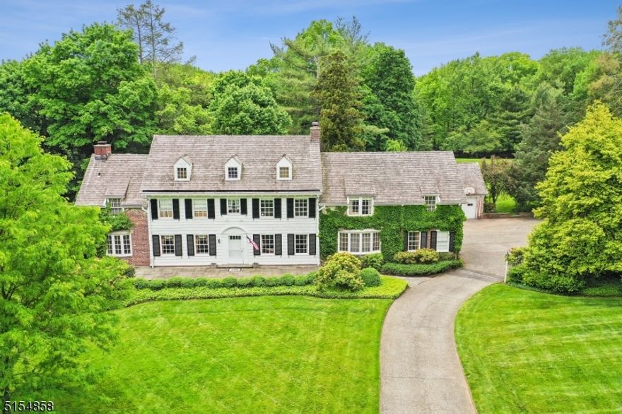 Only 23 miles outside Manhattan in prestigious Short Hills, NJ, an extraordinary opportunity has reached the market for the first time in decades. This stately 1928 center hall colonial stands majestically on over 3.32 level acres. It is a timeless beauty ready for its next steward to make it shine. The 7,000 square foot, eight-bedroom, six-and-one half-bath brick and cedar-clad and ivy-covered estate was built with fine craftsmanship and is replete with architectural detail. Expansive rooms are enhanced with large windows, dentil crown moldings, wood-paneled walls and paneled arched doorways for unparalleled elegance. Mature trees surround the sprawling and picturesque grounds to create a serene retreat, while the courtyard and multiple slate patios allow for entertaining large or intimate gatherings. It's an exquisite property that offers enough space for expansion while maintaining its private advantage. A short distance to town and NJ Transit Direct's train line, it ensures easy access to NYC, Newark Airport, and a quick drive to beaches or the mountains. Short Hills boasts one of the nation's best public school districts as well as top private school options. In today's market, it's almost impossible to find a home like this with so many possibilities: exceptional infrastructure, spectacular acreage, prime location, and a canvas awaiting your vision, this residence presents a wealth of great possibilities. It's a remarkable home.