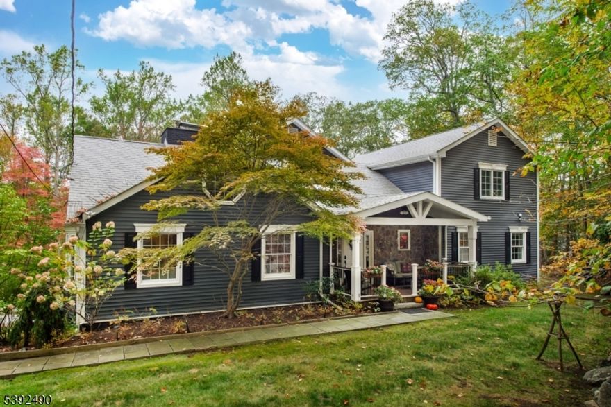 Welcome to this beautiful, expanded custom home in the prestigious Smoke Rise community. Featuring 5 bedrooms and 5 full baths as well as a large bonus room, this residence offers elegant living and exceptional space for a variety of living situations.  If you have been looking for a property with a great backyard, look no further. The home sits on a beautiful, level lot, surrounded by mature trees, colorful flower gardens, and lush greenery, the perfect setting for outdoor entertaining and peaceful everyday living. Ample acreage allows for room to build a pool and the owners have obtained plans for a 1000sq ft raised deck to complete the outdoor entertainment space. The large, level lawn and straight, flat driveway are great for sports and games and a fully enclosed vegetable garden is ready for growing your own produce. Inside, discover spacious living areas, a bright kitchen, and multiple ensuite bedrooms designed for comfort and versatility. The home has an updated heat pump furnace that cuts the heating and cooling costs dramatically. A full sprinkler system keeps the entire property looking gorgeous. Enjoy all the amenities Smoke Rise has to offer, including a private lake & beach, clubhouse dining, 24-hour security, and a true sense of community. A rare opportunity to own a beautifully appointed home in one of Kinnelon's most desirable neighborhoods!