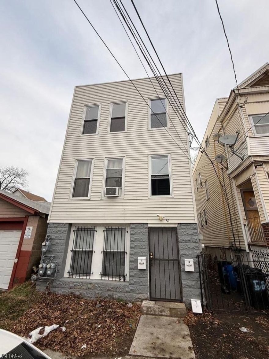 Fully renovated in 2020, this spacious and bright three-family home is located in a rapidly growing area and offers an excellent opportunity for both investors and owner-occupants. This classic three-story property features three well-designed units, each offering an open floor plan with 3 bedrooms, 1 full bathroom, an eat-in kitchen, and a generously sized living room.Extensive upgrades completed in 2020 include new plumbing, updated electrical systems, new mechanicals, new windows, and a newly installed front sidewalk. Each unit boasts modern kitchens with soft-close cabinetry, granite countertops, and stainless steel appliances. Additional features include forced hot air heating, a combination of laminate flooring and ceramic tile throughout, and bright, comfortable living spaces.The property offers separate utilities for each unit, making it an ideal income-producing investment with affordable property taxes. Conveniently located near schools, shopping centers, and public transportation with easy access to New York City.