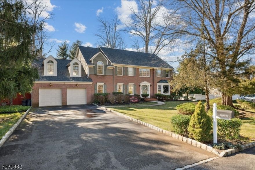 Picturesque Colonial nestled near a nature reserve in the sought-after Drakewick neighborhood of Mendham Twp. Near shopping, dining, award-winning schools and effortless commuting routes, the home has brand-new roof, basement flooring & freshly painted interior. A welcoming 2-story foyer ushers you to an airy main floor with gleaming hardwood floors, custom millwork & crown molding. The living room features a sunny bay window & open flow into the family room with verdant views & wood-burning fireplace perfect for cozy nights. The formal dining room offers an elegant space for entertaining. Gorgeous chef's kitchen equipped w/custom glazed cabinetry, striking center island, 2 Sub-Zero refrigerators, professional Thor range, wet bar & breakfast nook with built-in window seat. Just beyond is a sunroom with terracotta tile leading to a Trex-Deck perfect for al fresco dining amidst a private tree-lined backyard. A convenient main-floor laundry & mudroom, office, attached 2-car garage & full bath completes this level. Upstairs you'll find an oversized primary suite w/sitting room, WIC & stunning spa-like bath with dual stone-topped vanity, corner jetted tub & walk-in shower. Three more Bedrooms, one with en-suite bath & a full bath with dual vanity in the hall. The fully finished walkout Lower Level houses a huge recreation space & abundant storage areas. This home offers the perfect combination of charm & comfort for those seeking elegant living surrounded by natural beauty.
