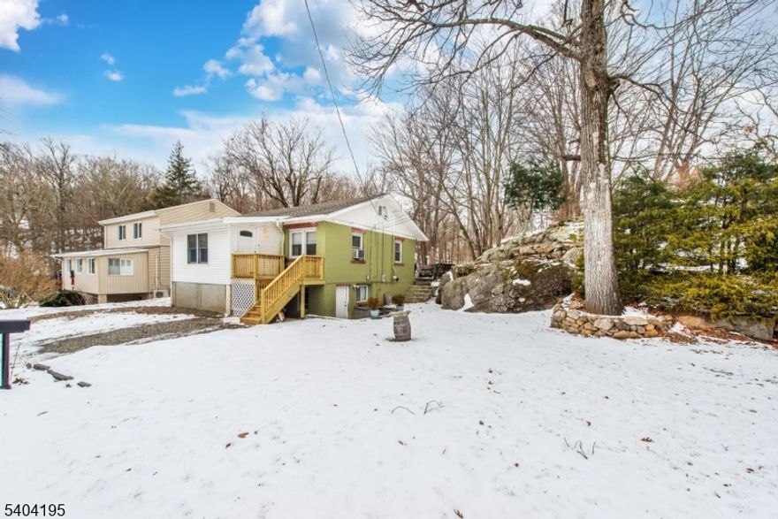 Welcome to this beautifully updated three bedroom home with ample parking.  In 2017 the furnace, water treatment, and a 3 bedroom septic were installed . Vinyl flooring installed in 2025. Enjoy the views from the lake with the OPTION to join the Private Beach Club located at the end of the street.  Buyer is responsible for due diligence of Lake membership. Sale is contingent on sellers finding suitable living. This home is a MUST SEE!