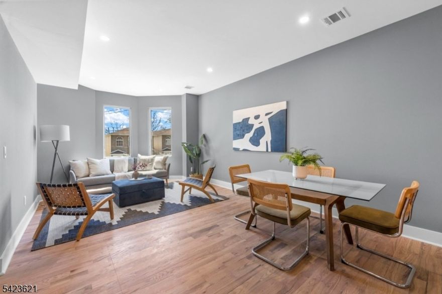 Stunning fully renovated 2-family duplex-style home in Bergen-Lafayette. Each sun-drenched unit spans 2 levels with 4 bedrooms, 3 full baths, featuring high ceilings, recessed lighting, and designer finishes throughout. Unit 1 offers a finished walkout basement, full bath, and access to a great size backyard. Unit 2 boasts NYC skyline views. Enjoy open-concept living, sleek kitchens, and spa-like bathrooms. Total of 8 bedrooms, 6 baths   ideal for owner-occupants or investors seeking strong income potential / house-hack opportunity. Located in a great neighborhood, near the Light Rail with easy access to NYC, parks, and local dining.