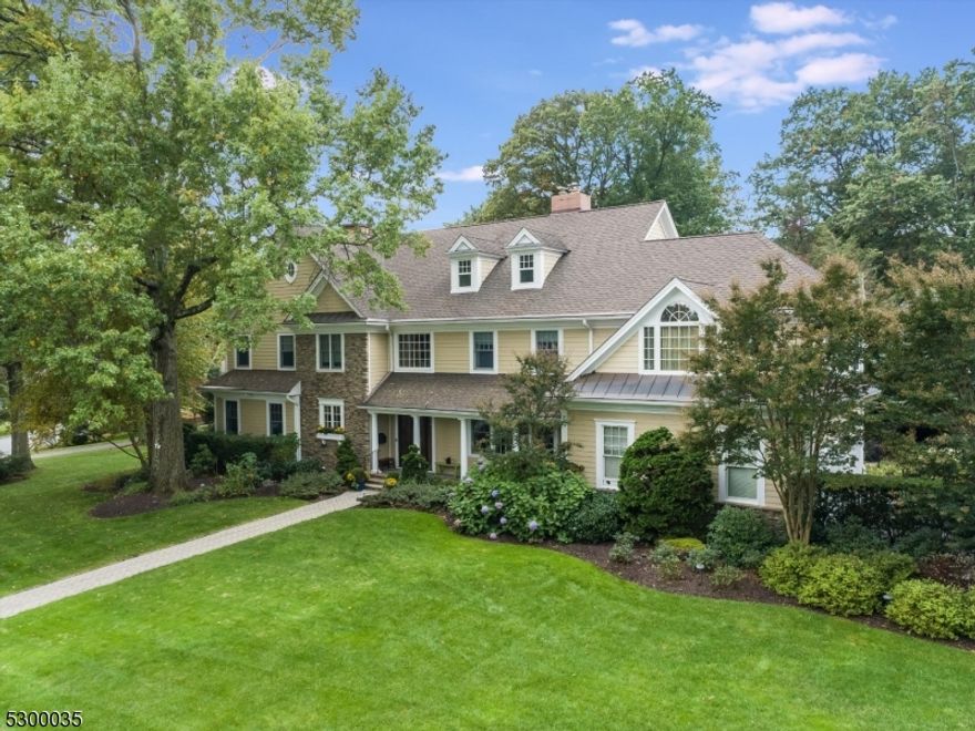 A true forever home. this new construction colonial boasts luxurious touches around every corner - inside and out. A grand entry hall sets the tone for the expanse and elegance of this home. The main level offers a dynamic, yet comfortable flow, anchored by multiple fireplaces, with a formal dining room, the coveted "TV room off the kitchen" and a front great room. The open concept chef's kitchen is well equipped with a 6-burner range, custom range hood plus traditional and wall-mounted ovens. Additionally, there is a main floor laundry room and a custom built mudroom just off the 2-Car garage for added convenience. The second level features 5 bedrooms and 3 bathrooms, with a huge primary suite and two other ensuite bathrooms. On the 3rd floor you have a perfect in-law/au pair suite with a full bath, lounge area and large bedroom. The sprawling lower level comes with a half bath and tons of space for a rec room, gym, art studio and storage. The gem of the home is the brand new 4-season porch off the kitchen. Outside, you'll find an outdoor grilling station and a patio, perfect for hosting gatherings and enjoying the beautiful weather. The the expansive front yard mature landscaping provides plenty of space for outdoor activities. Located in a stunning neighborhood with winding streets and beautiful parks, this home is just around the bend from Brookdale Park and Upper Montclair Village.