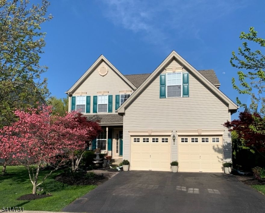 Perfectly positioned on a premium cul-de-sac lot in one of Bridgewater's most desirable neighborhoods, this impeccably maintained 4-bedroom, 2.5-bath offers the ideal blend of elegance, comfort, and location. This home is drenched in warm natural light. The beautifully landscaped backyard stays comfortably shaded during summer months for morning coffee, and weekend barbecues on the pristine brick patio. Step inside to a dramatic two-story foyer with open floor plan designed for both entertaining and everyday living. The upgraded kitchen features stunning Carrara white quartz countertops, SS appliances, 42-inch cabinetry, and a dining area with a bay window overlooking the backyard. The kitchen flows into the family room with a cozy fireplace. An extended formal dining room with an elegant bay window and a separate living room. A first-floor laundry/mud room with cabinetry and a powder room add everyday practicality. Upstairs, four spacious bedrooms with wood flooring. The primary suite is your private sanctuary, complete with a walk-in closet, additional "his and hers  closets, a dedicated office/sitting area, and a renovated spa-like bath featuring a double vanity, soaking tub, and glass-enclosed shower. The full basement expands your living space with a large recreation area, gym space, generous storage, and a partially finished room perfect for guests, or a home office. Located just minutes from top-rated Blue Ribbon schools, major highways, and NJ Transit.