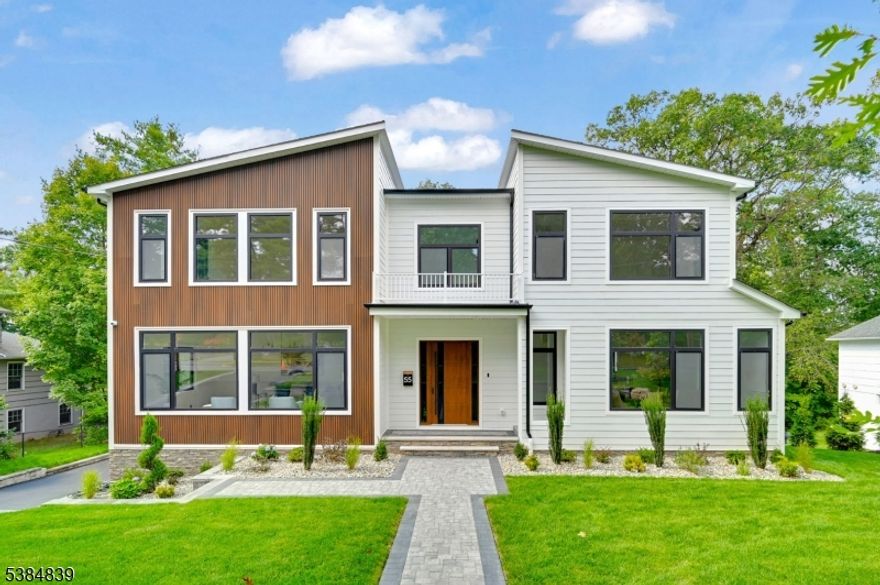 Welcome to 55 Troy Drive, a stunning new construction home in the prestigious Short Hills neighborhood. Set on half an acre of beautifully landscaped grounds, this home features seven expansive bedroom suites, each with its own private bath, and 2 powder rooms offering a home that is as functional for everyday living & extraordinary for entertaining. At the heart of the home, a grand chef's kitchen shines with a premier appliance package by Sub-Zero, Wolf, and Fisher & Paykel. Complementing it is an enormous butler's prep kitchen, elevating the art of hosting and ensuring every gathering flows seamlessly. A formal office provides a quiet retreat for working from home, while the walkout basement expands your lifestyle possibilities with a full wet bar, surround sound system, and a waterproof under-deck system that blends indoor comfort with outdoor enjoyment. Modern convenience is built into every detail: 300-amp electric service, generator-ready; Whole-home Wi-Fi hotspots indoors & outdoors; Integrated family room speakers with receiver; Basement surround sound system & High-end security camera & DVR system. Perfectly positioned just minutes away from Deerfield Elementary School, one of the most sought-after schools in the district, the location is as practical as it is prestigious. Designed with beauty, resilience, and forward-thinking infrastructure, this residence comes complete with a 10-Year Builder Warranty a true testament to lasting quality and peace of mind.