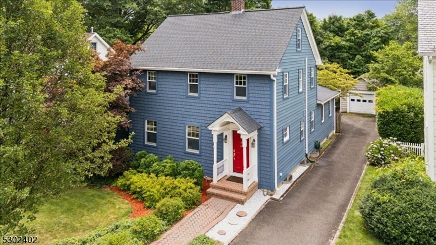 This beautiful side hall Colonial offers a tasteful blend of elegance and contemporary flair with 3 bedrooms, 1.5 baths, gleaming hardwood floors and a gracious layout. Unbeatable location mere blocks from downtown Basking Ridge with all you need just a short distance away shopping, restaurants, parks, top rated schools, highways, mass transit and more. Meticulous landscaping and stately front entry yields to an impeccably designed interior, opening with a stately foyer, a gorgeous light-filled living room and an adjacent formal dining room, and a powder room. French doors lead to a lovely sunroom with vaulted ceiling and skylights, perfect for an office. Next is a gourmet kitchen with all new cabinets, quartz counters and refrigerator, while the family room addition with vaulted and beamed ceiling and inviting brick fireplace will become your new favorite spot for everyday living. Three sets of sliding doors lead to a generous deck and fenced backyard beyond, ideal for easy warm-weather entertaining or relaxing in the sun. The 2nd floor offers 3 bedrooms with wood floors, and a full bath in the hall has a stone-topped storage vanity and custom tile. A partially finished basement houses a rec-room, laundry, utilities, storage and a workshop, and a walk-up attic and detached 1-car garage provide additional space. Move-in ready home boasting newer siding, roof with owned solar panels, and generator hookup. Nothing to do but move in and enjoy!