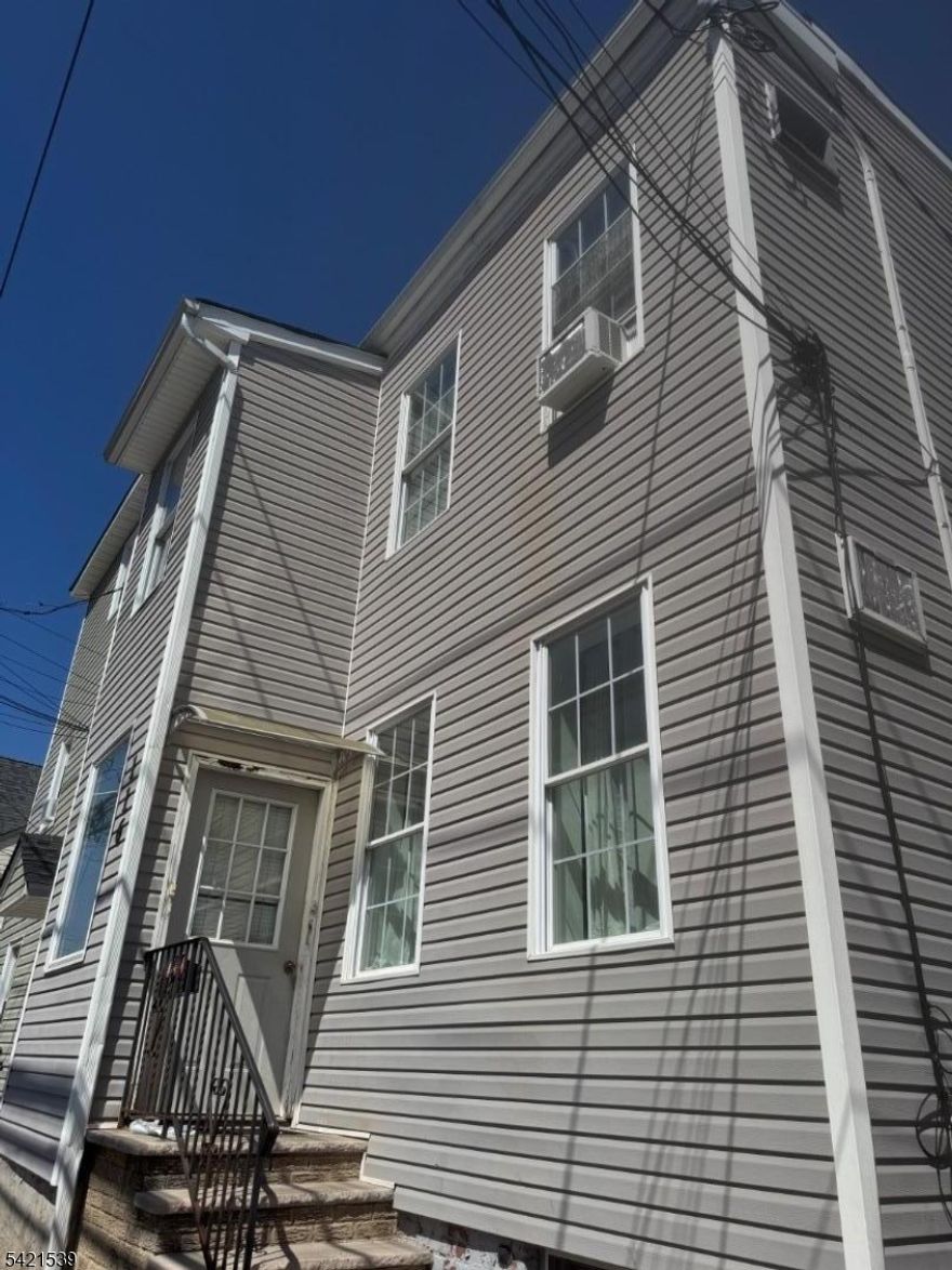 Spacious and well-maintained 2 family home located in a highly desirable area of Paterson; perfect for investors or owner occupants! The first floor unit offers living room, an eat-in kitchen, 4 generously sized bedrooms and 1 full bathroom. The second floor unit features living room, eat-in kitchen, 4 bedrooms, including a primary (master) bedroom with a private en-suite bathroom, plus and additional full bathroom. The property includes a fully finished basement, ideal for extra living space, recreation or storage. Recent upgrades provide peace of mind, including a new roof (2024), newer flooring throughout (2024), updated heating system components (2019), and a brand new water heater (2025) with a 10-year warranty. Conveniently located near schools, restaurants, shopping centers, public transportation and major routes offering easy access to everyday conveniences and commuting. Don't miss this excellent opportunity!