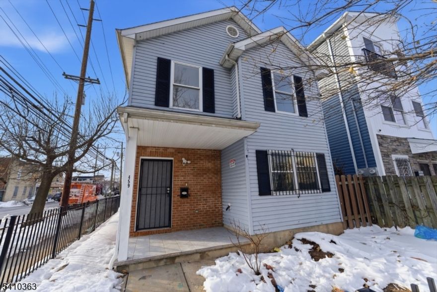 Well-maintained single-family home built in 2002, featuring 4 bedrooms and 2 baths with a welcoming covered front porch and a fully fenced exterior. The property includes a detached garage, offering convenient off-street parking and additional storage. Inside, enjoy a bright and open living space with beautifully finished hardwood floors and fresh, modern finishes throughout. The updated kitchen showcases white cabinetry, sleek countertops, stainless steel appliances, and tile flooring perfect for everyday living and entertaining. Clean lines, neutral tones, and updated lighting create a move-in-ready feel. Conveniently located near transportation, shopping, and local amenities. Hurry - book showing today and make this yours!