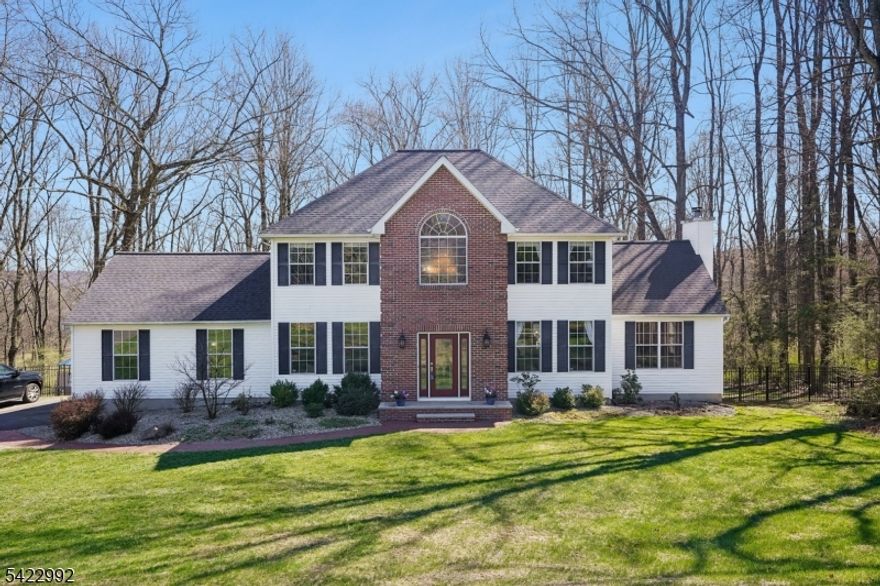 Elegant, Grande & stately describe this custom colonial nestled on lushly landscaped property in Danville Mountain Estates.  The wild factor begins the moment you pull up to this stunning home.  A paver towpath leads to the front entry that opens to a grand 2 1/2 story formal entry with arched palladium window  very inviting!  The foyer opens to a large formal sitting room (being used as office) or elegant sun, drenched, formal DR w/gleaming HW Floors.  An amazing chef's kitchen with huge Center island, SS appliances, granite countertops, breakfast bar that opens to breakfast room with sliders to tiered deck overlooking the fenced in yard and the wooded grounds  and a stunning voltage ceiling great room anchored w/woodburning fireplace  this is an entertainer's dream. The main level also features a huge walk-in pantry/mudroom, PR and access to the garage. The upper level features, two generous size bedrooms, large, main bath and a primary suite w/amazing WIC and spa like Bath w/double sinks  a total oasis!  The LL does not disappoint, offering high ceilings, walk out to yard, huge game room, exercise room, laundry, storage & more. This perfectly appointed home will surely impress and is not to be missed!