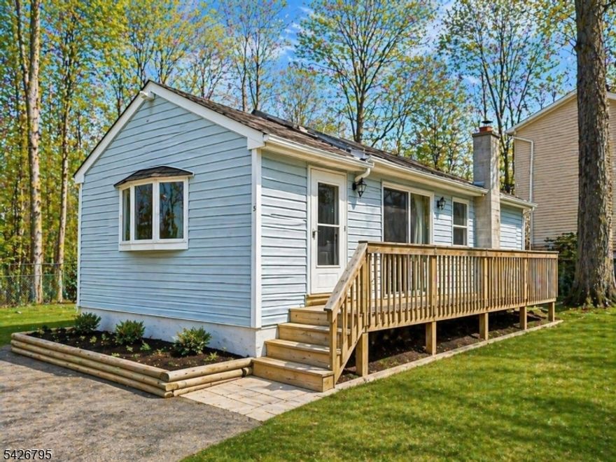 Great opportunity for an owner-occupant, investor, or buyer looking for a home with rental potential in close proximity to Lake Hopatcong. This open-concept ranch offers vaulted ceilings, skylights, laminate flooring, and multiple sliders that bring in natural light and connect the living space to the outdoors.The home features 2 bedrooms, including a primary bedroom with access to the rear deck. A wrap-around deck, level fenced yard, and off-street parking add to the home?s appeal and usability. The partial basement/crawl space includes laundry, utilities, and additional storage.Enjoy nearby access to Lake Hopatcong, restaurants, recreation, boating, fishing, hiking, and major routes including Routes 80 and 46. Property needs some updating and personal touches, but offers strong potential for the right buyer.