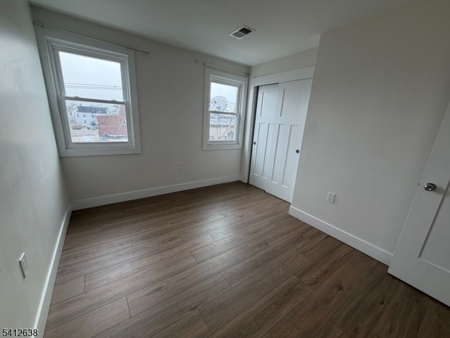 A fully renovated top floor unit with three bedrooms, one full bath and laundry hook-up in unit. Each room has its own closet, and additional pantry in the back. New HVAC/electric and plumbing. New windows. Located in Newark's Ironbound, just across from Seabras Market and dozens of food and shopping choices on Wilson Avenue and Ferry Street. This well-kept property is just a block and a half from Wilson Avenue School. Super easy access to local transportation and less than one mile from Newark Penn Station, taking you straight into NYC.