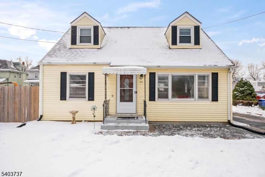 Welcome Home! This charming Cape Cod-style home offers a warm and cozy atmosphere with a spacious first floor filled with natural light. The first-floor features hardwood floors, a welcoming living room, kitchen, and formal dining room ideal for everyday living and gatherings. A first-floor bedroom and full bath add extra convenience and flexibility. Upstairs, you'll find two generously sized bedrooms with plenty of space and storage. The partially finished basement provides even more room to enjoy, including a family room, laundry area, and workshop. Outside, the spacious and private backyard is perfect for playtime, relaxing, or entertaining. Tucked away on a quiet street, this home is still just minutes from major highways, restaurants, and shopping offering the perfect balance of comfort and convenience.