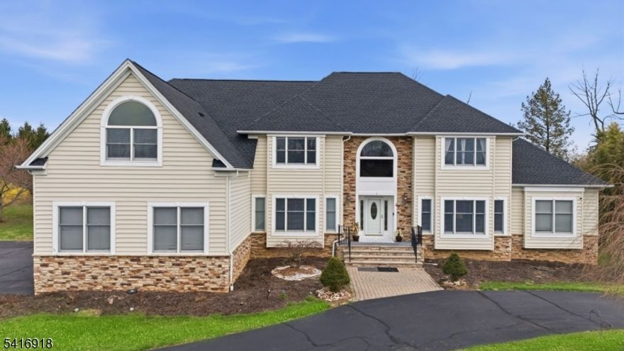 LUXURY LIVING W/ NEW ROOF (2025). Tucked at the end of a quiet cul-de-sac on 1.33 acres, this impressive 5BR, 5BA home offers space, privacy, and thoughtful upgrades. A rare 1st-floor guest suite with private bath and walk-in closet sits near the formal living room. The updated chef's kitchen features granite countertops, modern appliances, a new sink, and professional exhaust hood. Enjoy casual dining in the bright dinette or relax in the soaring family room that flows into a 3 season sunroom. Step outside to a massive deck and patio overlooking a lush, private backyard. The partially finished basement offers flexible space for a gym, media room, or recreation. A dedicated 1st-floor office/study adds convenience.Upstairs, the primary suite features a spa-like bath with Jacuzzi and dual sinks. Another bedroom offers a bonus sitting/flex space and shares a bathroom with an adjacent bedroom. An additional bedroom and hallway bathroom complete the level. Main-level laundry, 3-car garage, and circular driveway for 10+ cars.  Conveniently located about 30 minutes to Lambertville, Princeton, and Bridgewater; approx. 1 hour to Newark Liberty International Airport and Philadelphia International Airport; and about 30 minutes to Trenton"Mercer Airport. Located in a Blue Ribbon school district space, location, and lifestyle all in one exceptional home.