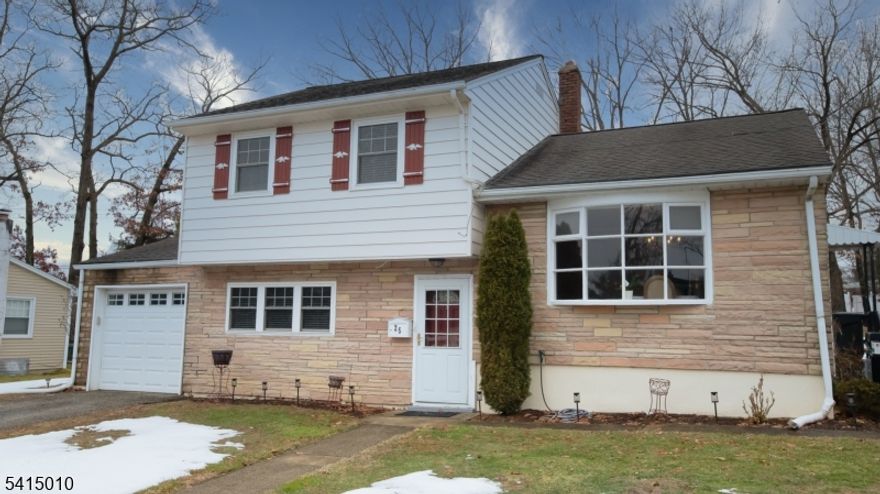 This beautiful ready to move in 4 bedrooms, 1 1/2 bath split level sits on generous lot 80'X141'. First floor has one bedroom and 1/2 bath that is perfect for in-laws. Hardwood floors throughout house. Eat-in kitchen has new stainless steel appliances and door that has small deck with stairs that leads to back yard. Exterior of house was painted in July, 2025. A/C installed in 2022. Water heater replaced in 2022. Furnace replaced in 2024. Main bath has original retro tiles in excellent condition. Attic access through one of third level bedroom. Garage has door entry to house. Laundry room on first level with door that lends to backyard. Close to 80, 46 and 10. Malls nearby and train station.