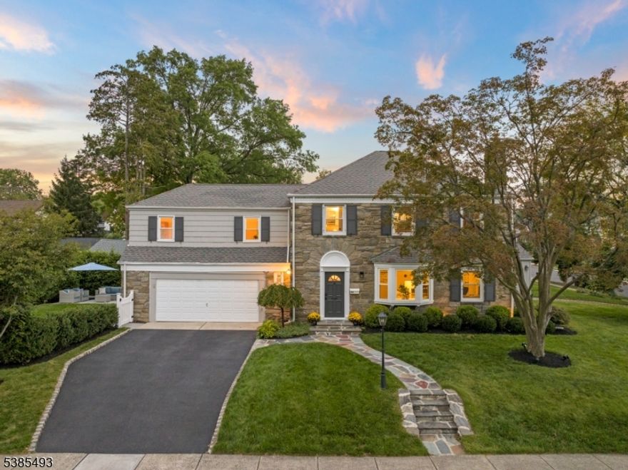 Welcome to this beautifully updated 5-bedroom Colonial, perfectly situated in Millburn's highly desirable South Mountain neighborhood. Blending timeless charm with modern convenience, this turnkey home is designed for effortless living. Step through the welcoming entry vestibule, complete with an oversized coat closet and foyer framed by French doors. The main level flows seamlessly, with open and sun-drenched living and dining areas, complemented by a cozy family room ideal for everyday gatherings. At the heart of the home, the chef's kitchen shines with a large center island, stone countertops, custom cabinetry, under-cabinet lighting, sleek finishes, and mostly new appliances. Upstairs, five spacious and versatile bedrooms provide comfort and flexibility for residents, guests, or home office needs, all served by renovated baths featuring fresh, modern design. The finished lower level adds even more living space with a bright recreation room, laundry, and ample storage. Outdoors, enjoy a private backyard retreat with newly designed patios and a level, fenced yard perfect for dining al fresco, lounging, or play. An oversized two-car garage and beautifully landscaped grounds complete the exterior. All this, in a prime location right next to the sought-after South Mountain Elementary School. Steps away from Millburn's top-rated upper schools, vibrant downtown, parks, direct train to Hoboken and NYC, & close to Newark Airport. This is more than a home, it's a lifestyle.