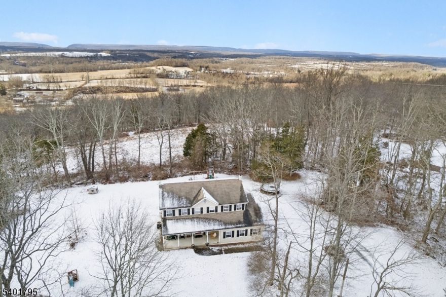 Young four bedroom, two and a half bath colonial with sweeping views of the Delaware Water Gap and surrounding mountains. Privately sited to capture panoramic scenery, this home offers an open, sun-filled layout with the kitchen open to the family room featuring a fireplace, creating an ideal space for entertaining and everyday living. The kitchen includes ample cabinetry, generous counter space, and a center island.Upstairs, the primary suite features a walk-in closet and full bath, along with three additional bedrooms and another full bath. Hardwood floors run through the main living areas, and large windows showcase stunning views in every season.A two-car garage, full basement with abundant storage, and a welcoming front porch add to the home's appeal. Located close to town amenities, outdoor recreation, and major commuting routes, this property delivers the perfect blend of modern construction, privacy, and dramatic mountain views. Fieplace and flues "as is" with no known defects.Relocation addendum applies.