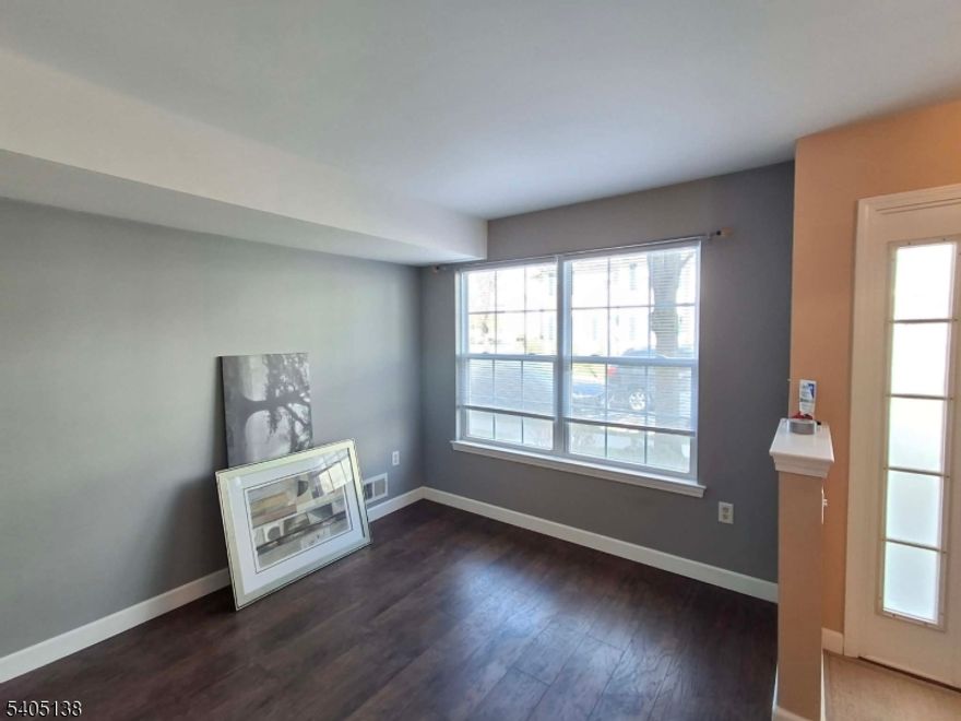 Rare opportunity to own a 3-level townhouse in Parlin's sought after LaMer neighborhood. This 2/3-bedroom, 2.5-bath home has a completely above grade level with finished laundry room, and den that can also be used as an office or 3rd bedroom if needed. Features include an open layout living dining room and kitchen, beautiful engineering steps and flooring , insulated windows, storage scuttle attic, above grade built-in finished 1-car garage and much more. Only unit with possible parking in front and in the back presently available in the desirable LaMer. Enjoy nearby parks and recreation areas. Community also offers gym, tennis courts and playgrounds. This townhome is a Commuter's delight with close proximity to NYC bus stop, major highways, Jon Bon Jovi Service Area on the GSP at Exit 124, train stations, and shopping.Just unpack and move right in!