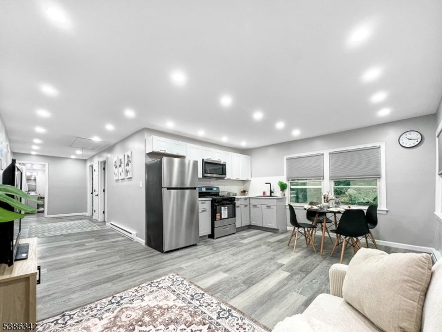 PACK YOUR BAGS AND MOVE RIGHT IN! This adorable ranch offers a great space for a variety of lifestyles, whether you're looking for a sweet starter home, a condo alternative, or to downsize. Step onto the charming front porch with its picket-fence detail and into a bright open-concept living and dining space that flows seamlessly into this beautiful kitchen. With fresh flooring, doors and hardware, and a stylishly updated full bath, this home is move-in ready. The home offers three comfortable bedrooms, including one with direct access to the back deck, could also be used as a home office, den, or guest room. A convenient laundry area adds to the ease of everyday living. Set on a generous sized lot, you'll have plenty of outdoor space to enjoy entertaining, gardening, or playtime. Located just blocks from shops and restaurants, and close to Mountain View Train Station for easy commuting. Routes 202, 23, and I-80 are only minutes away, making travel simple in every direction. Come see for yourself why THIS IS THE ONE!