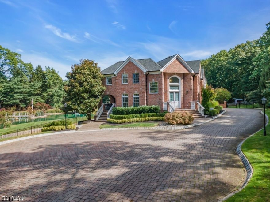 Experience resort-style living in this extraordinary home, offering over 6,800 sq. ft. of luxurious space where no detail has been overlooked. Outside, a private oasis awaits with a heated saltwater pool and a serene pond stocked with koi and carp, perfect for relaxation and entertaining. Inside, high ceilings, architectural moldings, and walls of windows fill the home with natural light. The gourmet kitchen features a granite island with a Viking range. The sprawling primary suite includes a spa-like ensuite. The walk-out lower level is an entertainer's dream with a full bar, movie theater, gym, game room, and full bath. Additional features include a generator, home automation, newer roof, and AC. A must-see!This estate also boasts a paddock, perfect for the equestrian enthusiast.