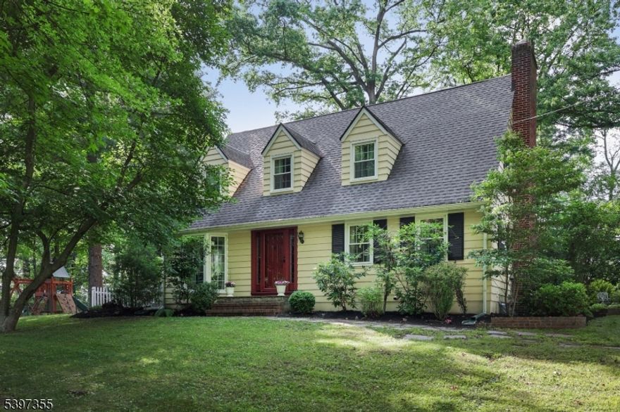 This extraordinary custom built cape cod, set back on 1.4 acres at the end of a long circular driveway, offers rare privacy, with beautiful views of nature along Rahway River Park. Step into this private retreat to enjoy a recently updated kitchen (2024) equipped with stainless steel appliances. Each of the 2.5 bathrooms (2023) have been tastefully renovated. Some of the major upgrades include the addition of central air conditioning (2017), new furnace (2025), brand new windows throughout and doors (2020) that enhance both energy efficiency and curb appeal. The spacious layout includes three generously sized bedrooms, with a primary ensuite. Two fireplaces add charm and warmth to the living areas. A full basement for laundry and a workbench provides plenty of storage and space. The meticulously maintained landscape screams pride of Ownership. Outdoor living is inviting, with a flagstone screened-in porch leading to a fenced-in side yard. In the evening enjoy the beautiful paver patio, complete with a fire pit overlooking the park. The location is a commuter's dream just one block from NYC-bound bus service and near the NJ Transit train station with a direct line to NYC. **BONUS !!! Landlord will cover the landscaping of the property.***